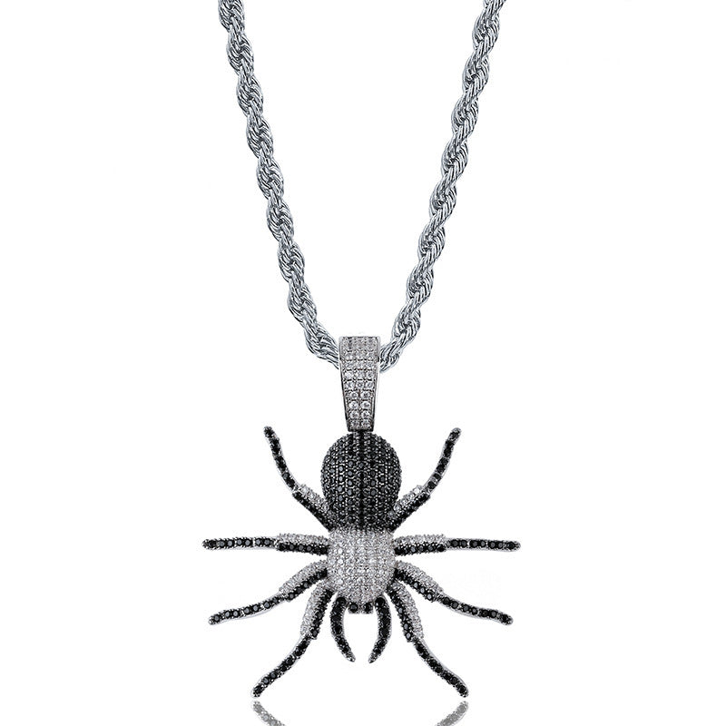 DatNewDrip iced out black spider pendant with black and white crystals on silver rope chain for statement jewelry