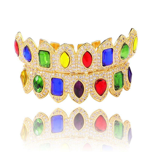 DatNewDrip gold grillz with multicolored gem settings and pave crystals showcasing colored gem grillz