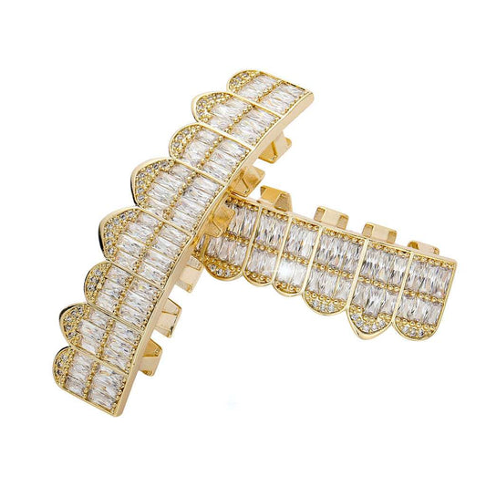 DatNewDrip gold iced out baguette grillz set with scalloped rows of baguette stones and crystal accents