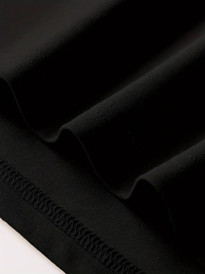 Close-up of fabric texture on a black Graphic Streetwear T-Shirt by DatNewDrip