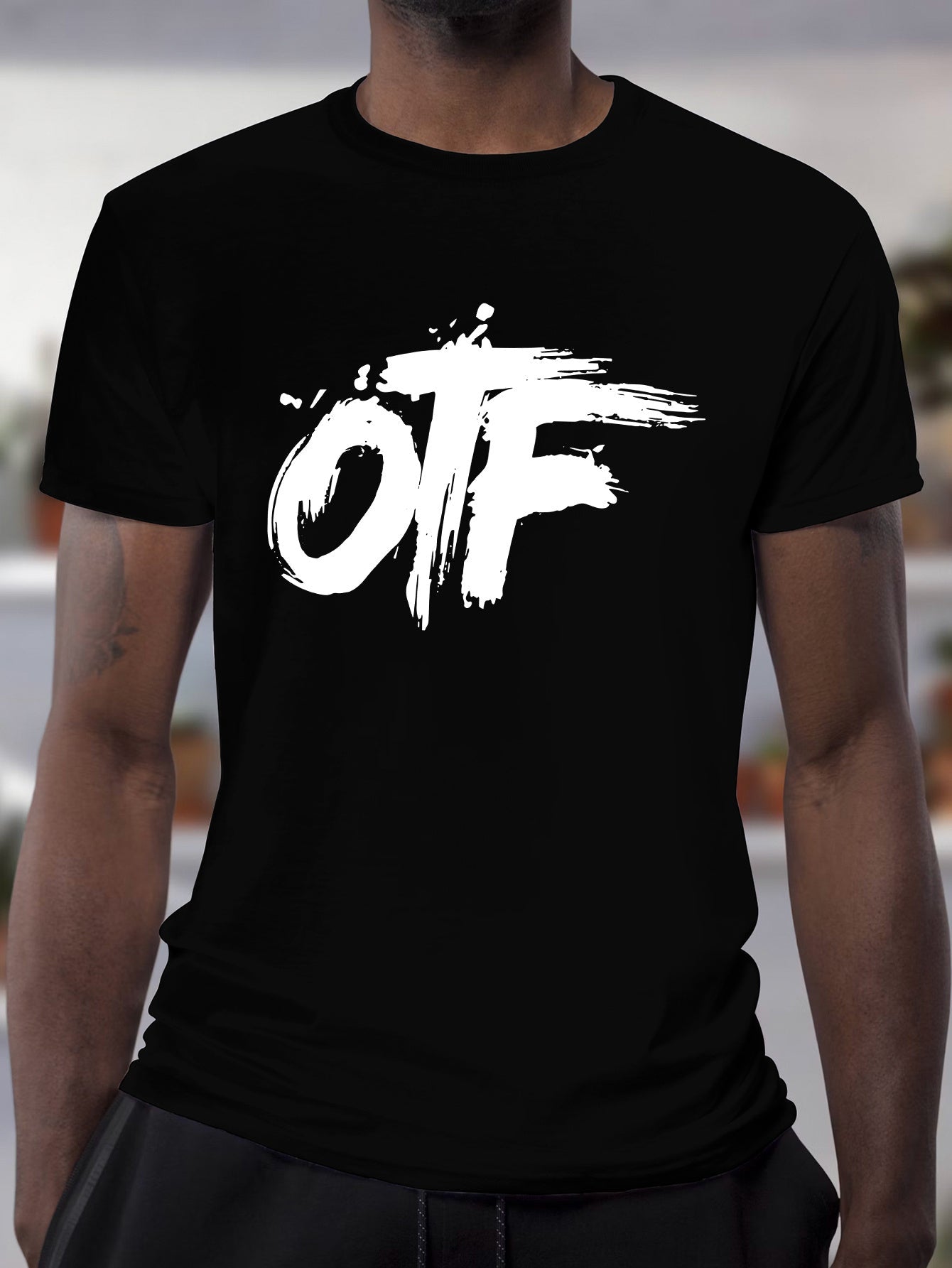 Black graphic streetwear t-shirt from DatNewDrip featuring bold OTF logo design