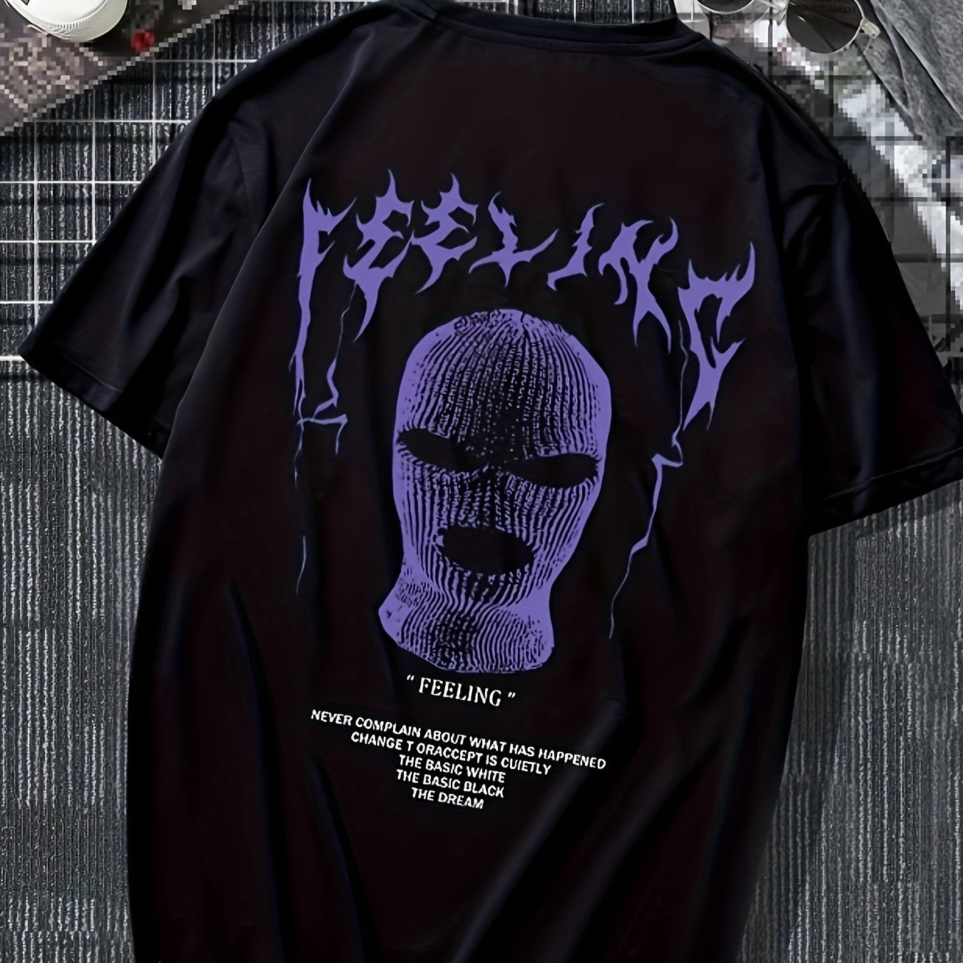 Graphic Streetwear T-shirt featuring bold purple design of a masked figure on a black background