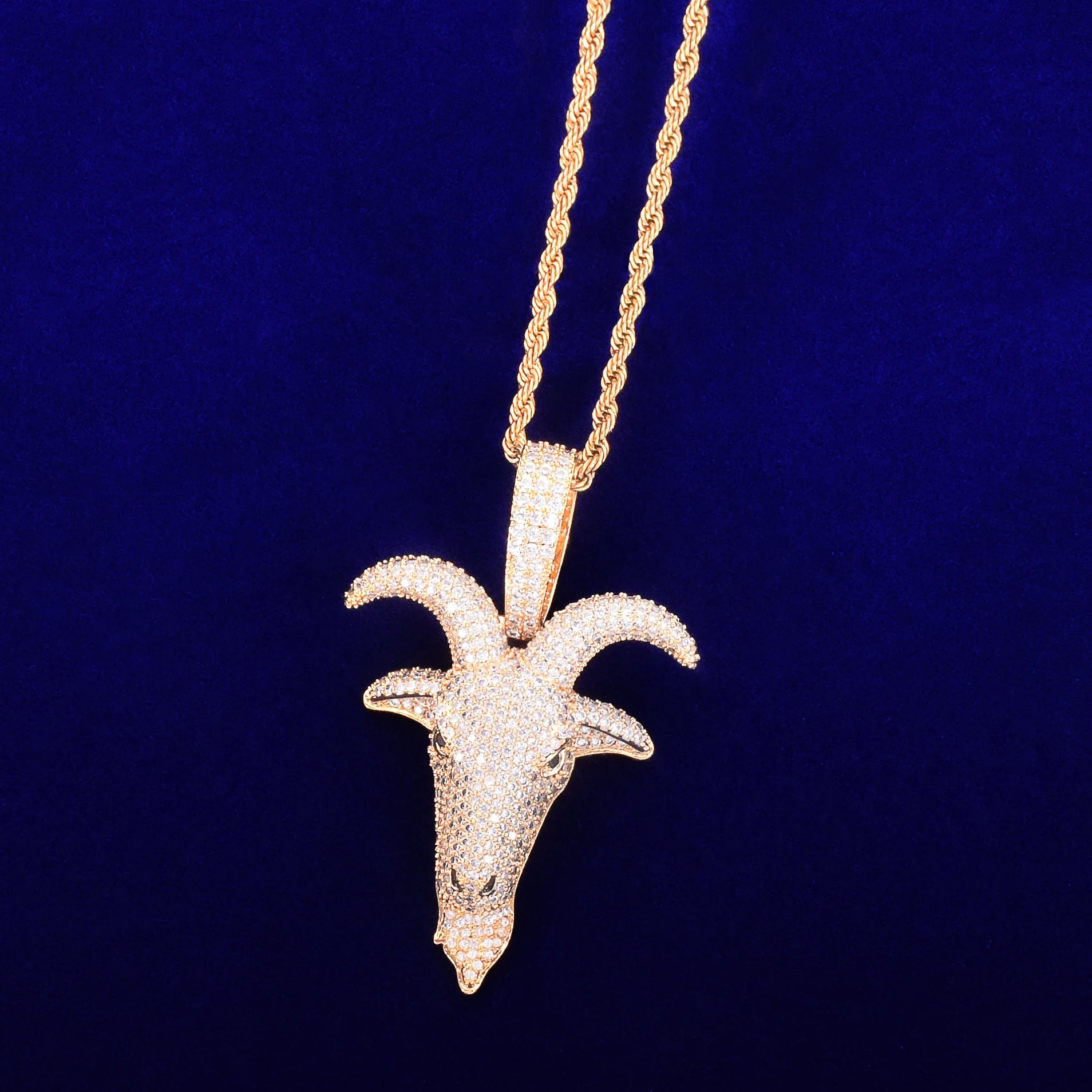 Gold hip hop sheep head pendant necklace adorned with sparkling gemstones on a twisted chain