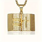 Gold iced out bible pendant with sparkling rhinestones and a cross design, on a chain necklace