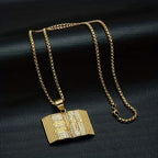 Gold iced out bible pendant with detailed engraving on a matching chain necklace