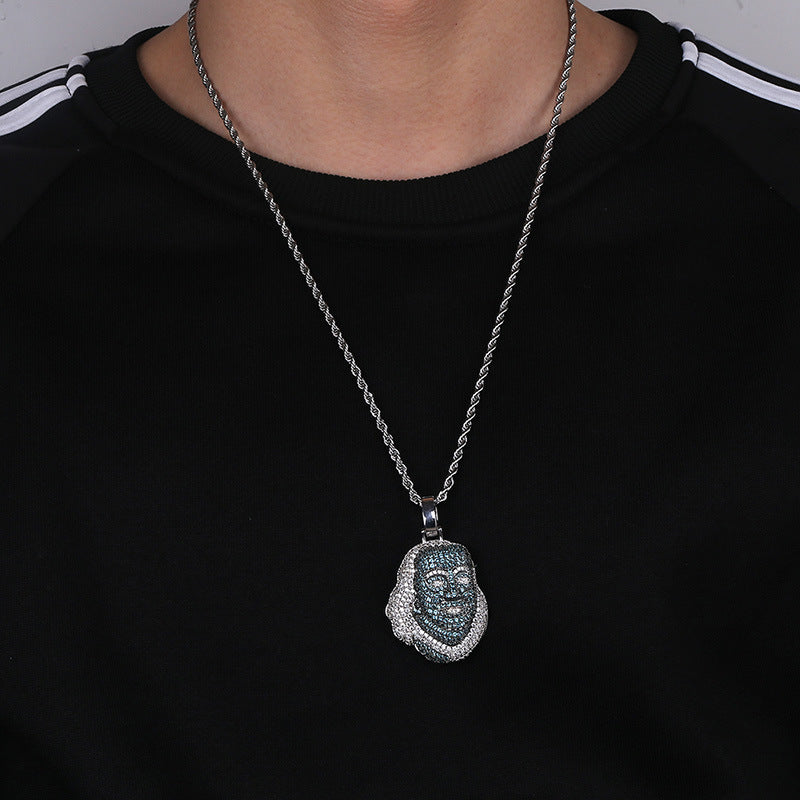 DatNewDrip Iced Out Blue Face Pendant necklace worn over black shirt with silver chain