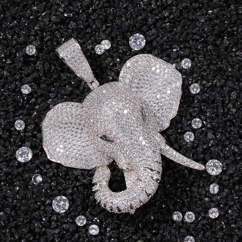 DatNewDrip iced out elephant pendant encrusted with sparkling stones on black textured background
