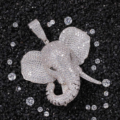 DatNewDrip iced out elephant pendant encrusted with sparkling stones on black textured background