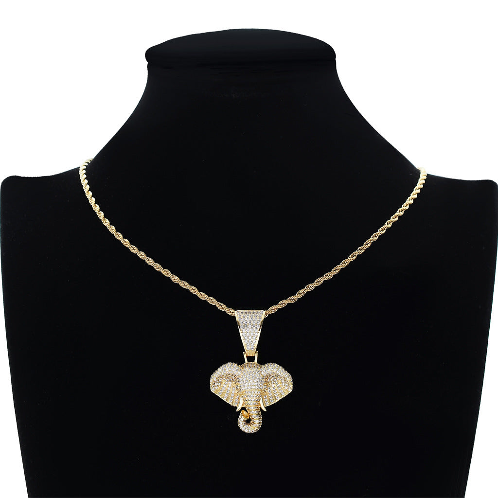 DatNewDrip iced out elephant pendant necklace with gold chain on black display