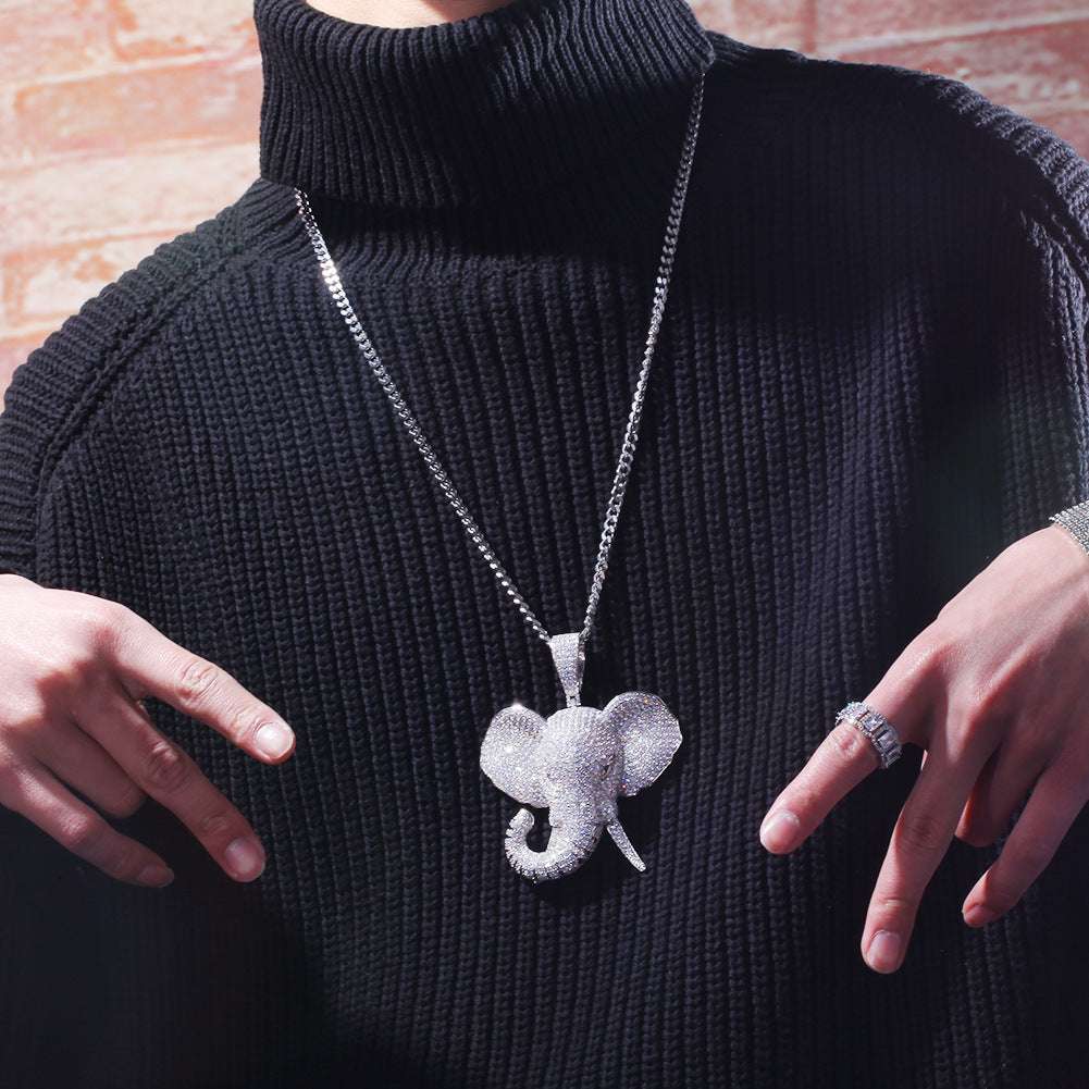 iced out elephant pendant necklace worn over black sweater with silver chain jewelry style