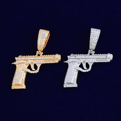 Iced out gun necklace in gold and silver with sparkling stones for a stylish statement piece