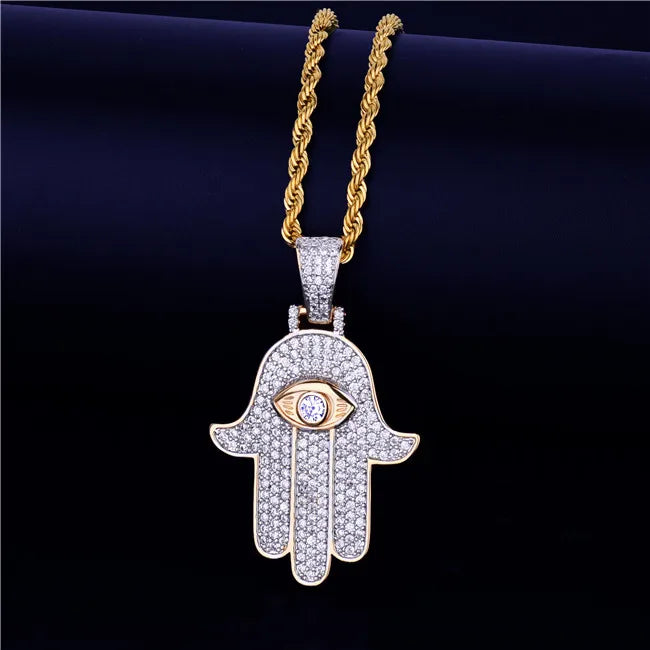Iced out hamsa hand pendant necklace with diamond accents and gold-tone chain for a stylish look