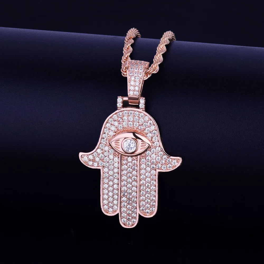 Iced out hamsa hand pendant necklace in rose gold with detailed crystal embellishments