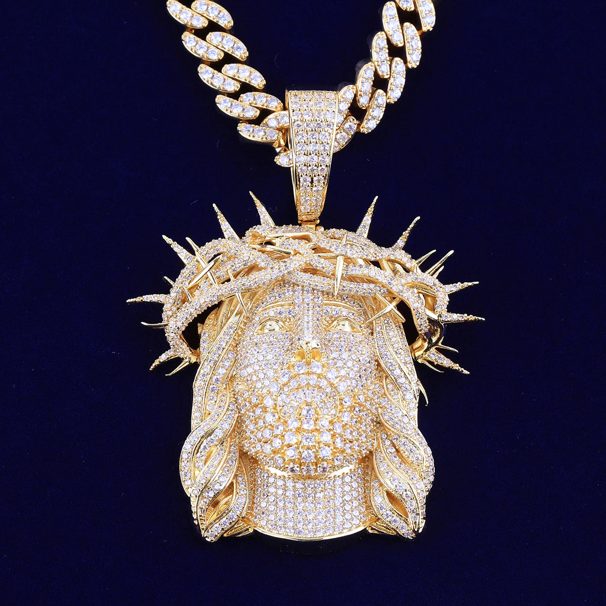 Iced out Jesus piece necklace in gold with intricate detailing and sparkling accents