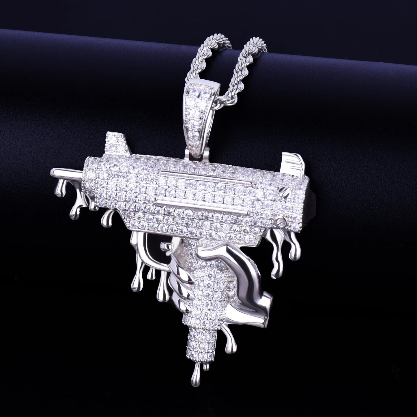 Iced Out Opps Uzi Pendant Necklace featuring a detailed design with shimmering stones and a stylish chain