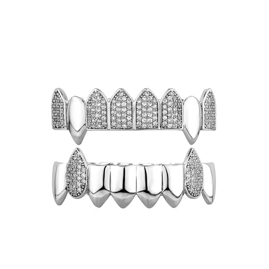 iced out fang grillz set in silver with pave crystals upper and lower vampire tooth design
