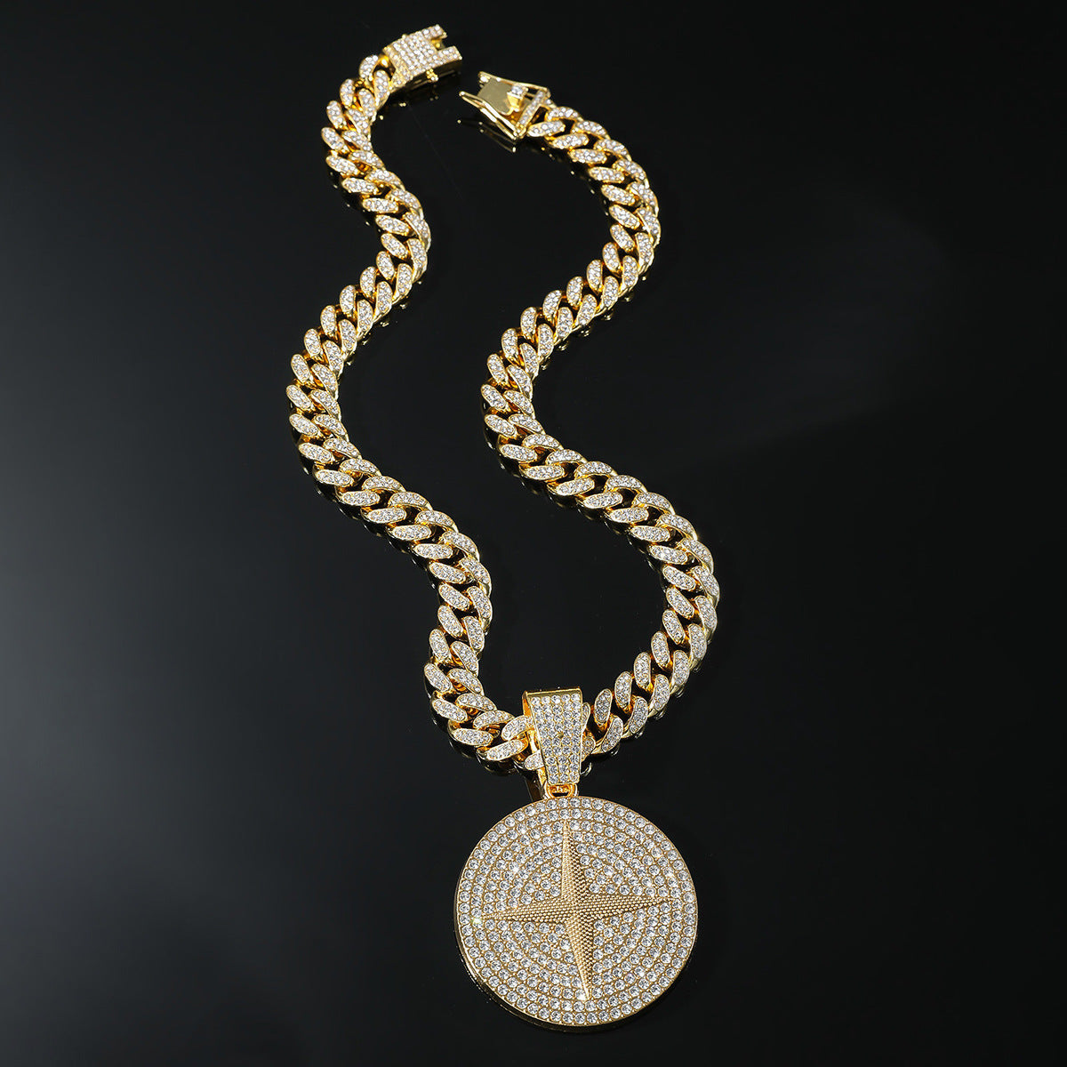 DatNewDrip iced out compass pendant on gold Cuban link chain with pave crystals and lobster clasp