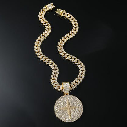 DatNewDrip iced out compass pendant on gold Cuban link chain with pave crystals and lobster clasp