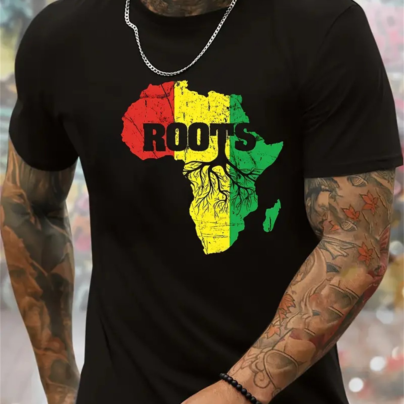 Roots One Love t-shirt featuring a vibrant Africa graphic in red, yellow, and green colors