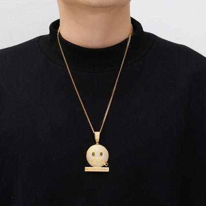 DatNewDrip iced out no rats pendant gold emoji face pendant on gold chain modeled on black sweater