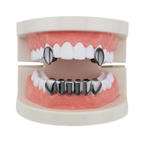 DatNewDrip stainless steel vampire grillz for teeth shown on dental model with upper fangs and full lower set