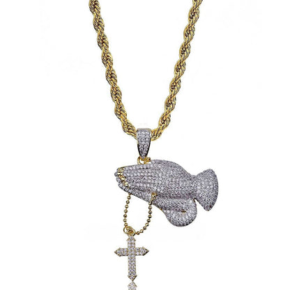 DatNewDrip iced out praying hands pendant on gold rope chain with dangling cross pave stones and two tone finish