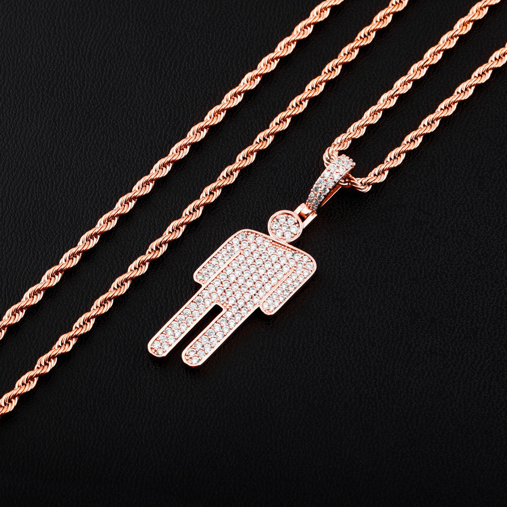 DatNewDrip rose gold rope chain necklace with iced out Billie pendant covered in pave stones on black backdrop