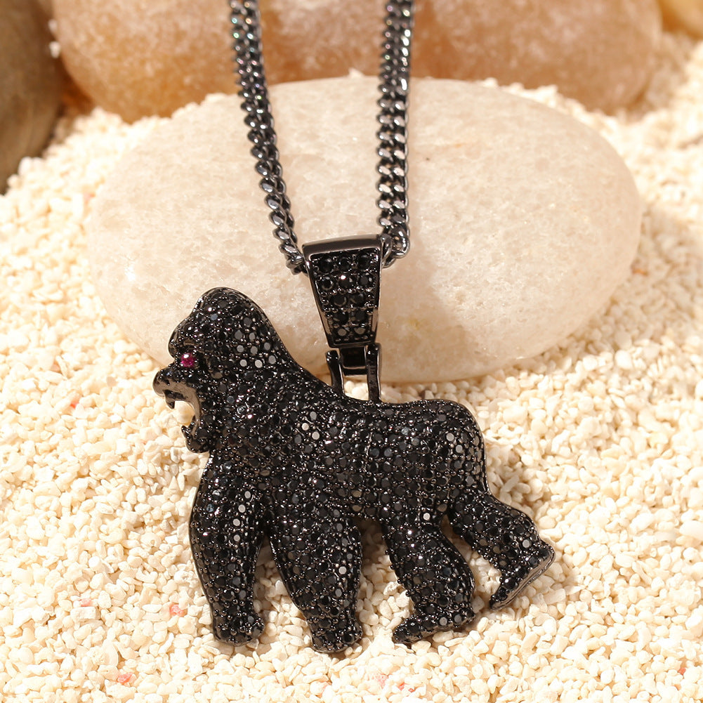 DatNewDrip iced out gorilla pendant in black gunmetal with pave stones and red eye on curb chain