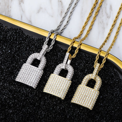 DatNewDrip iced out lock pendant trio in silver and gold with pave crystals on rope chains