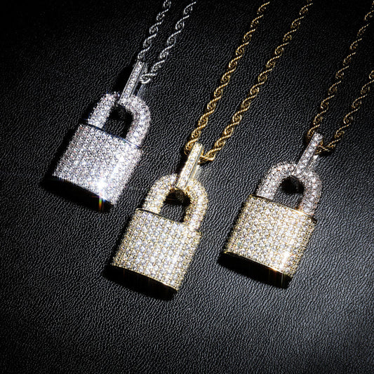 DatNewDrip iced out lock pendant trio in sterling silver and gold tones with pave crystals on rope chains