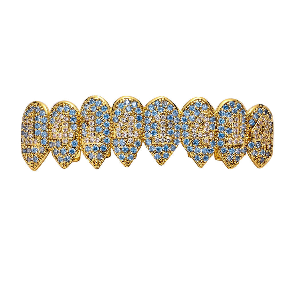 DatNewDrip iced out monster fang grillz gold fang tooth caps encrusted with blue and clear stones full upper set