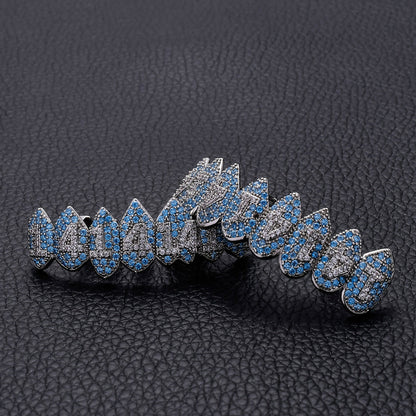 DatNewDrip iced out monster fang grillz in silver with blue and clear stones detailed fang design
