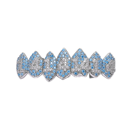 DatNewDrip iced out monster fang grillz silver tone with blue and clear stones for dramatic fang tooth look