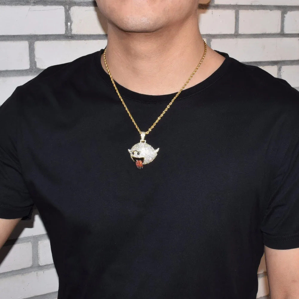 DatNewDrip Iced Out Naughty Ghost Pendant on gold chain worn by model over black tee against brick wall