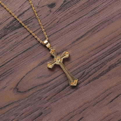 DatNewDrip gold chain with iced out cross pendant on wood background showcasing engraved details